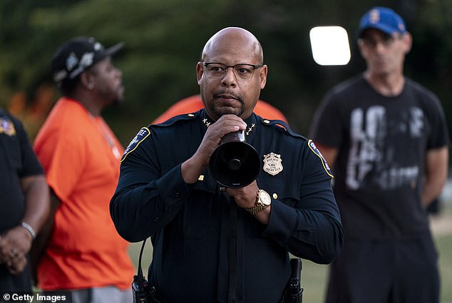 Seattle police chief is FIRED by woke mayor after he was filmed squaring up to reporter who asked him about deadly shooting