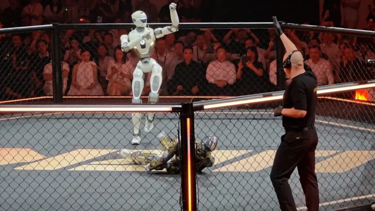 Combat robot performs funny victory dance after knocking rival to the floor